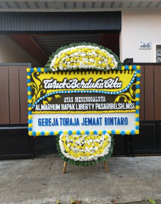 Papan Bunga Duka di Kadolomoko